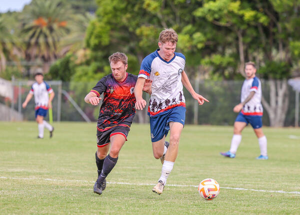 Chris Dooley and Campbell Brear competing for the ball 
